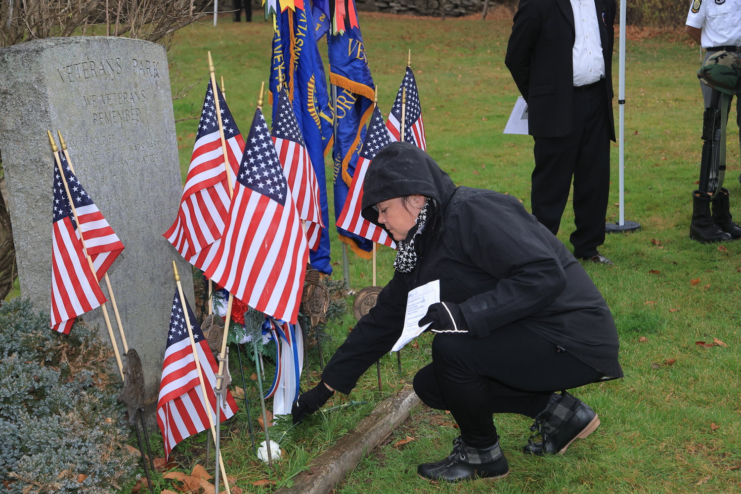 A member of the VFW Ladies Auxiliary takes part in the laying of the Veterans Day wreath at the foot of the monument stone at Veterans Park, Honesdale, PA.